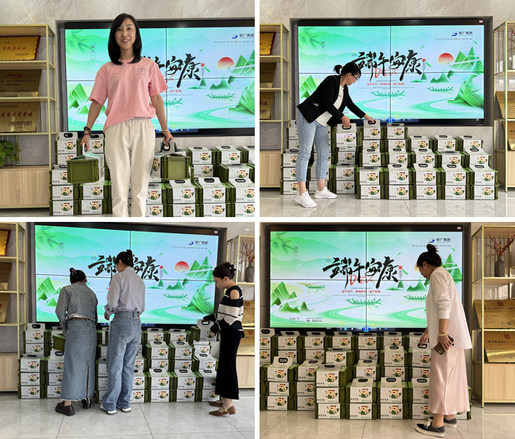 乾广集团员工洋溢着快乐的笑容领取端午节福利